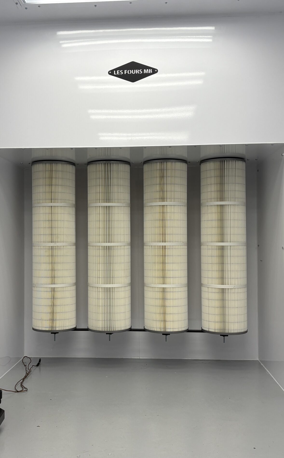 Distributeur de filtre pour chambre à peinture en poudre 